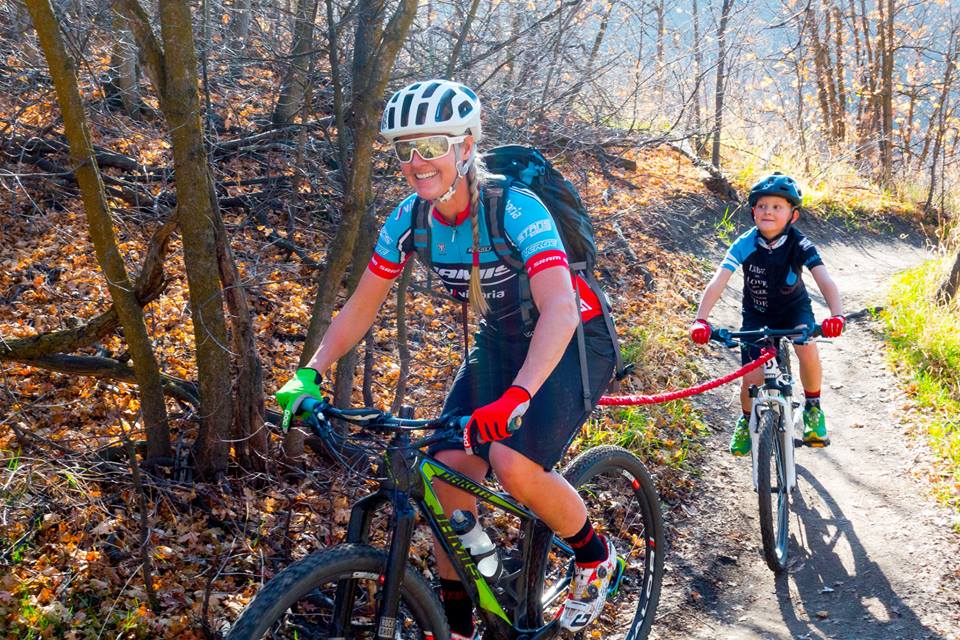 Lady pulling a child up a hill with a TowWhee Bungee